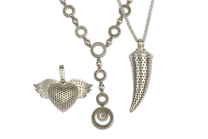 silver-colored chain necklace with heart pendant