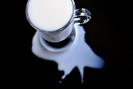 closeup photo of spilled clear teaglass