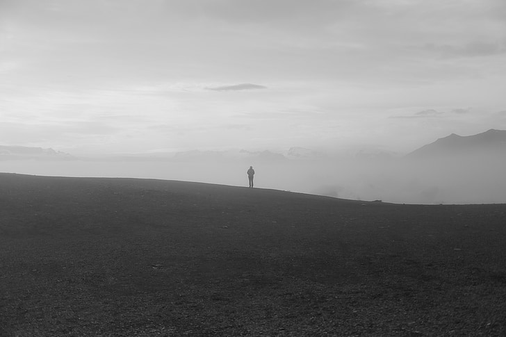person standing on gray field