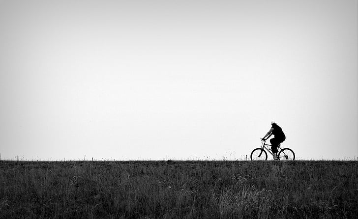 person riding on bicycle at road
