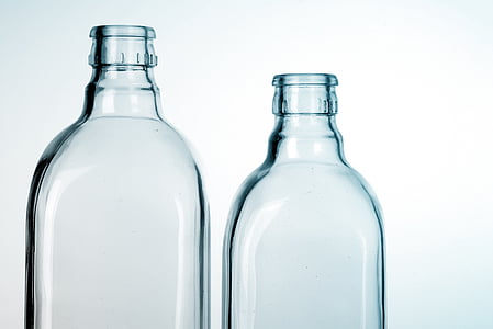 two clear glass bottles