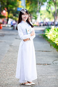 woman in white turtleneck long-sleeved maxi dress