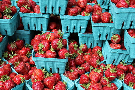 bunch of strawberries on crates