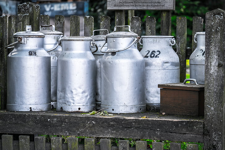 close-up photography of several assorted gray stainless steel containers