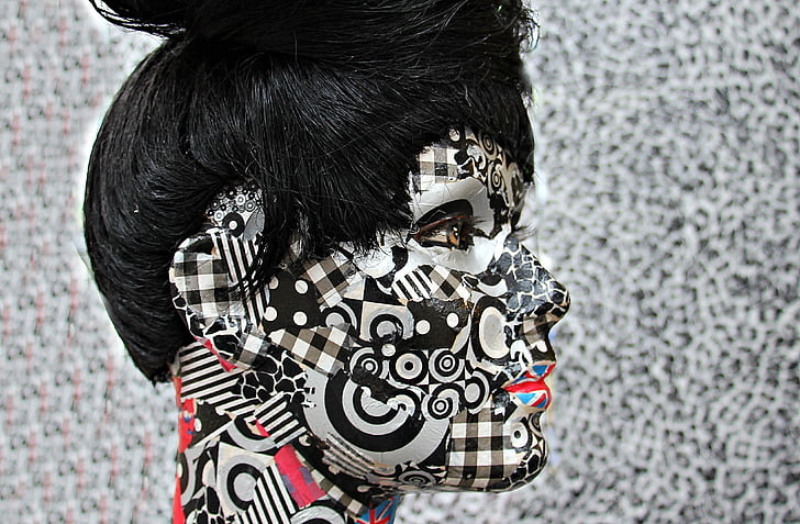 woman with black and white face painting