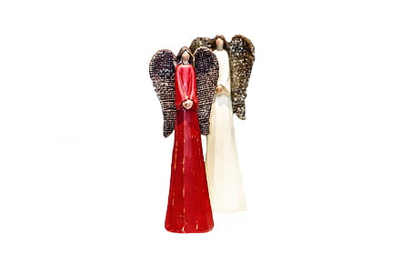 two red and white angel figurines