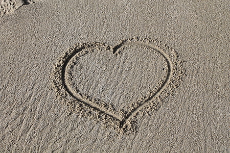 heart sand art photo during daytime