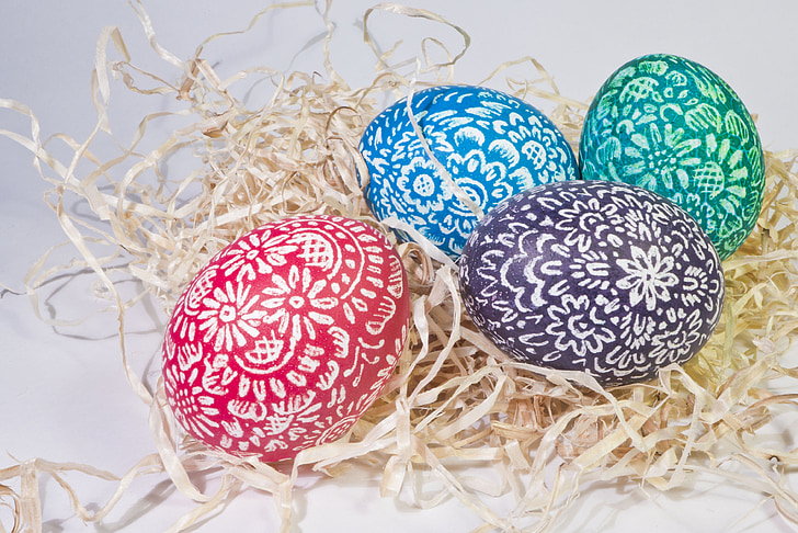 four assorted-color easter eggs
