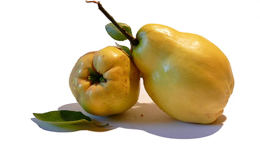two yellow fruits on white surface
