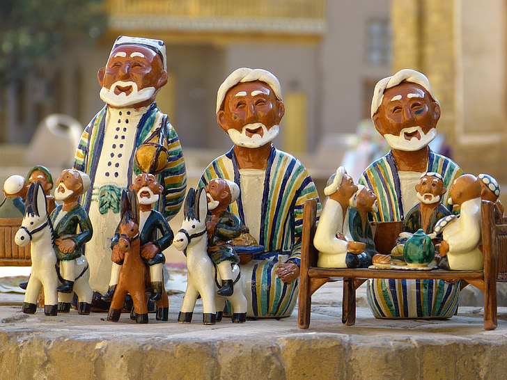 brown-and-white ceramic figurines