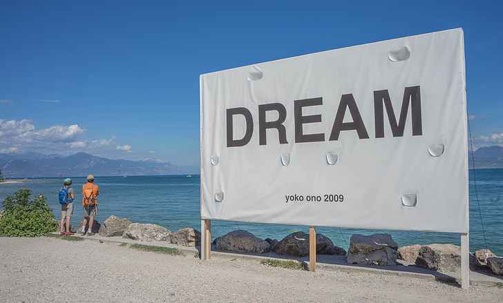 Dream signboard near body of water