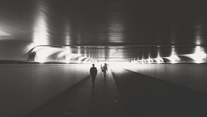 man walking on tunnel