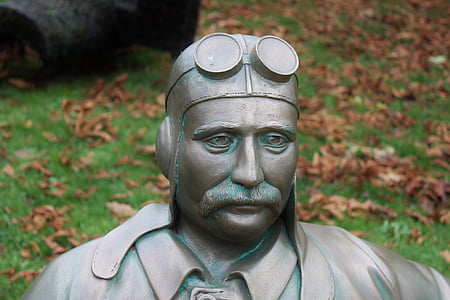 man with googles statue