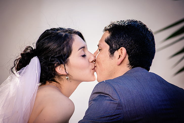 wedding couple kissing each other