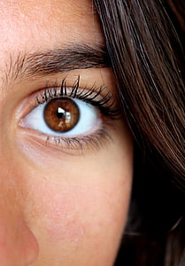female's left brown eye