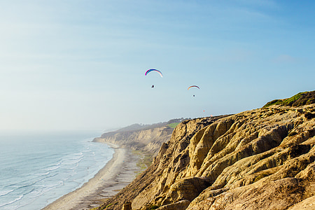 two person doing paragliding during daytime