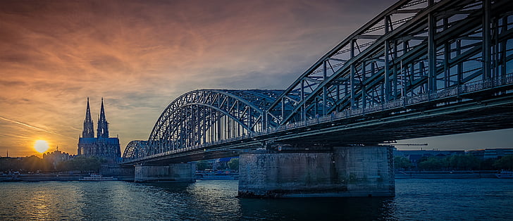 gray bridge under sunset