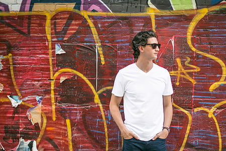 man wearing white v-neck t-shirt facing right direction