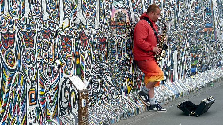 man playing saxophone on the street