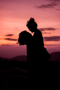 silhouette of couple during golden hour