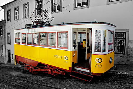 selective color photography yellow and black Carris tram
