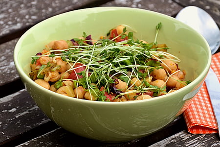 vegetables in bowl beside spoon