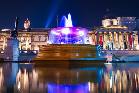 timelaspe photography of fountain during night time