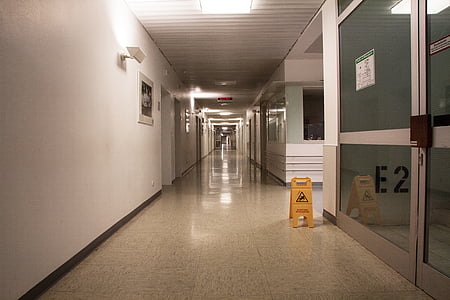 hallway with gray ceramic floor tiles