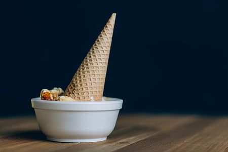 closeup photo of ice cream on bowl with cone