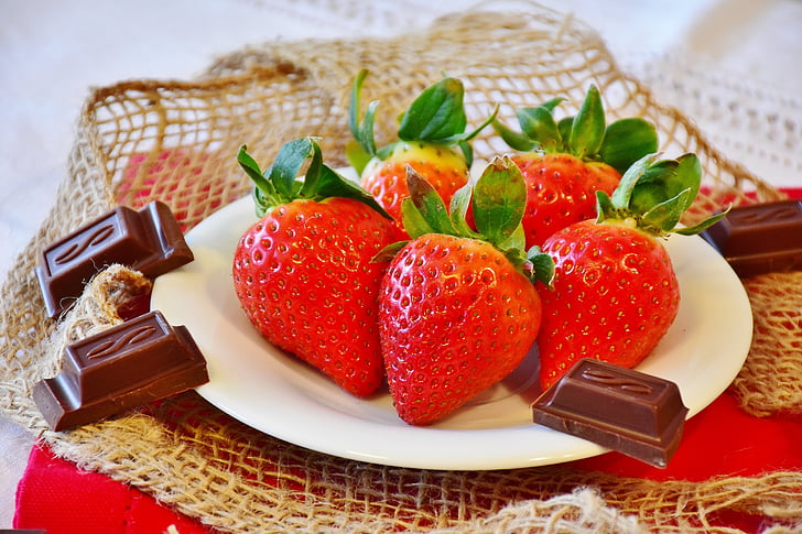 strawberries and chocolate on plate