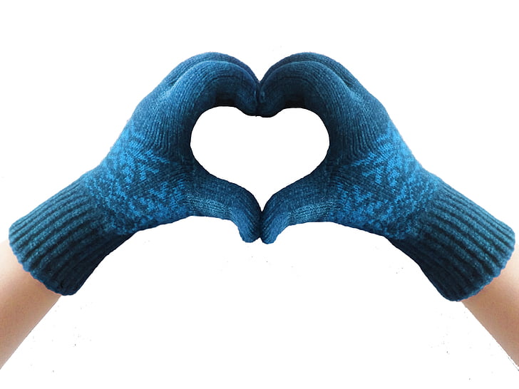 photo of person forming hand heart gesture