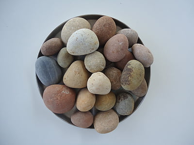 assorted pebbles in black container
