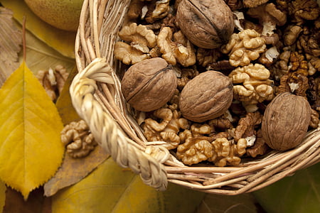 photo of brown nuts on beige wicker basket