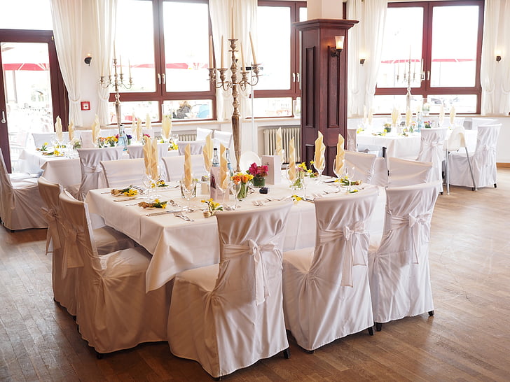 rectangular white table and chairs on floor