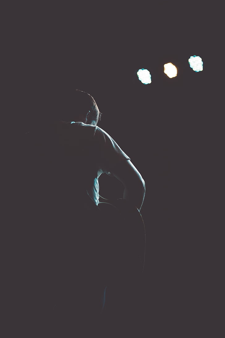 silhouette of male musician