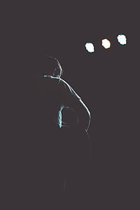 silhouette of male musician