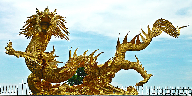 shallow focus of gold dragon statue