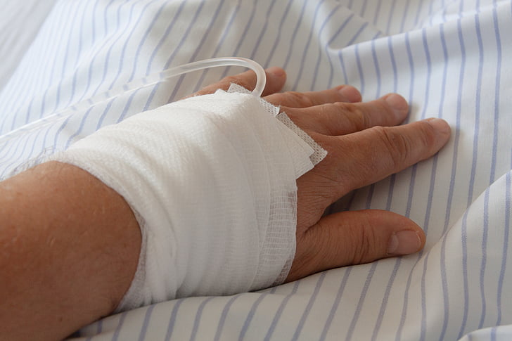 person's hand with dextrose