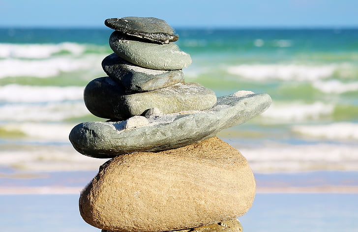stacked rocks near seashore