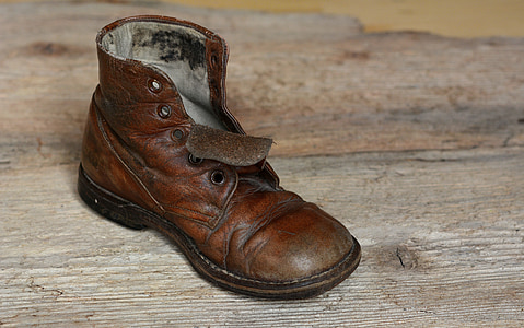 unpaired brown leather boot
