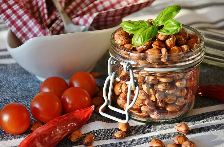 brown peanuts in glass jar