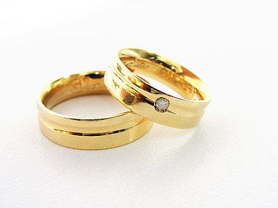 gold-colored couple rings