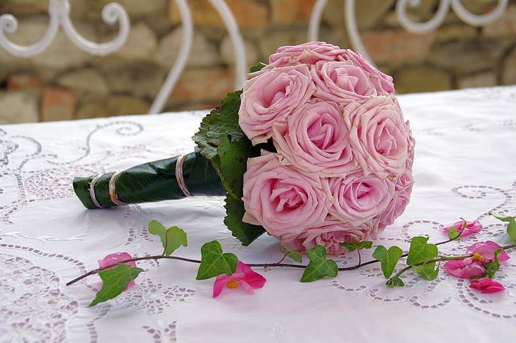 bouquet of pink roses on white table top