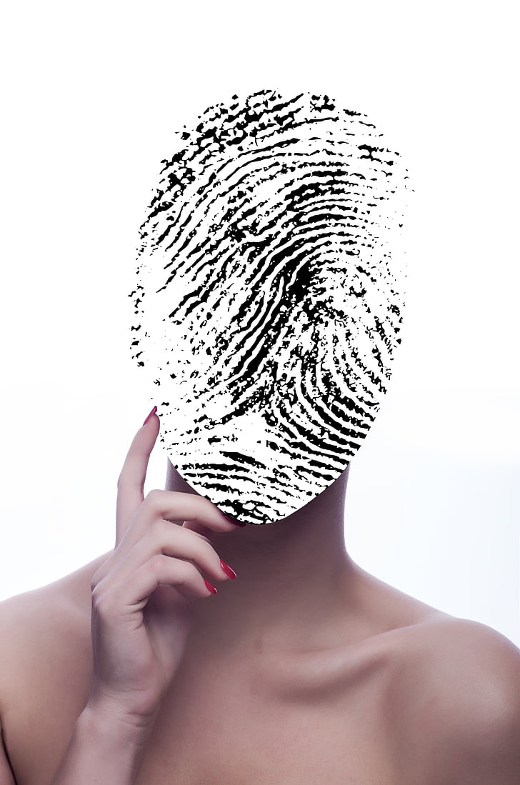 black and white finger print on person's face
