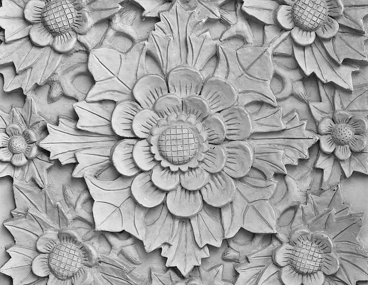 grey concrete floral sculpted surface closeup photography