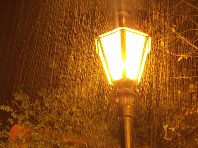 black outdoor light post on rain