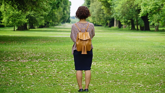 woman standing on green grass