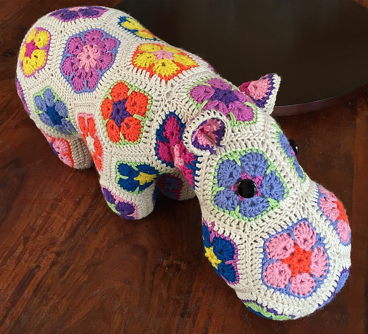 white and pink hippo crochet toy