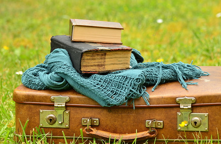 book and teal scarf on the briefcase