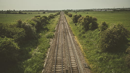 photo of train railings during daytime